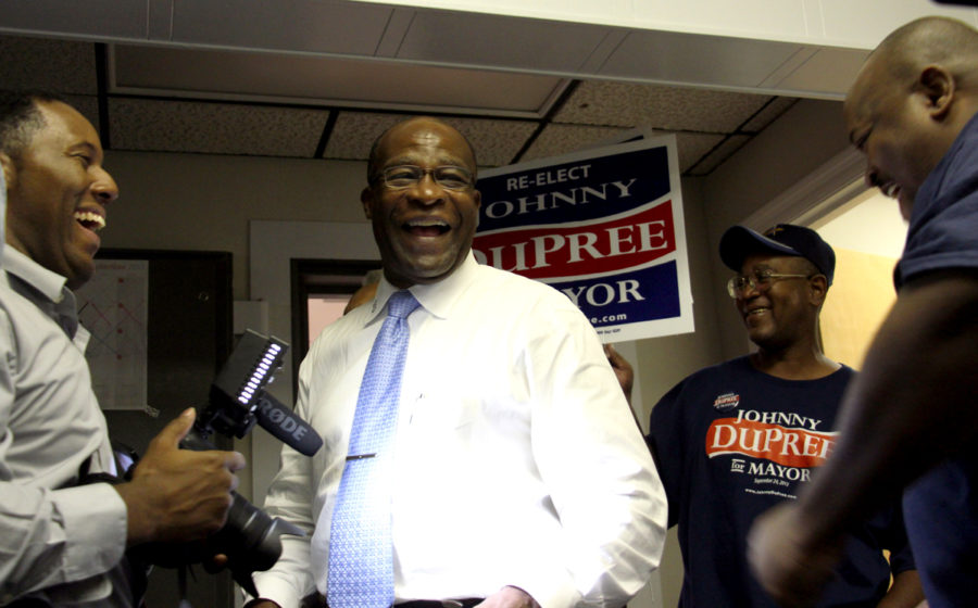 Mayor Johnny DuPree talks with supporters after speaking to the press at his campaign headquarters Tuesday.

April Garon/Printz