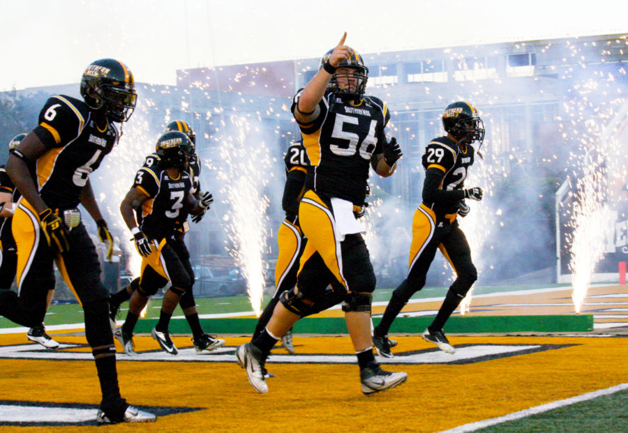 The Golden Eagles run onto the field to face North Texas during Saturday’s Homecoming game. 

Michael Kavitz/Printz