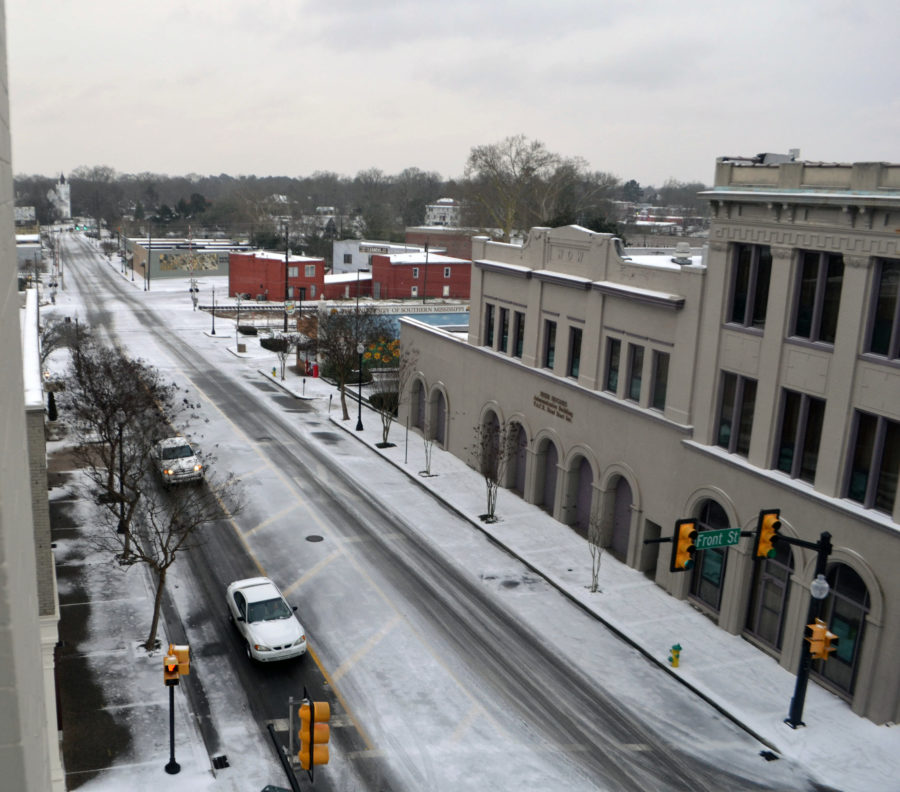 Snowfall continues in downtown Hattiesburg on Tuesday, Jan. 28.