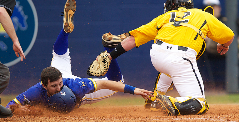 USM+catcher+Matt+Durst+tags+out+McNeese+State%E2%80%99s+Reed+Gordy+at+home+in+the+bottom+of+the+fifth+inning+Sunday.%0A%0ARick+Hickman%2FLake+Charles+American+Press