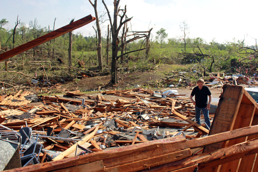 Joe Holloway surveys damage from the American Legion in Tupelo Tuesday morning, April 29. A dangerous storm system that spawned a chain of deadly tornadoes over three days flattened homes and businesses, forced frightened residents in more than half a dozen states to take cover and left tens of thousands in the dark Tuesday morning.

Zachary Odom/Printz