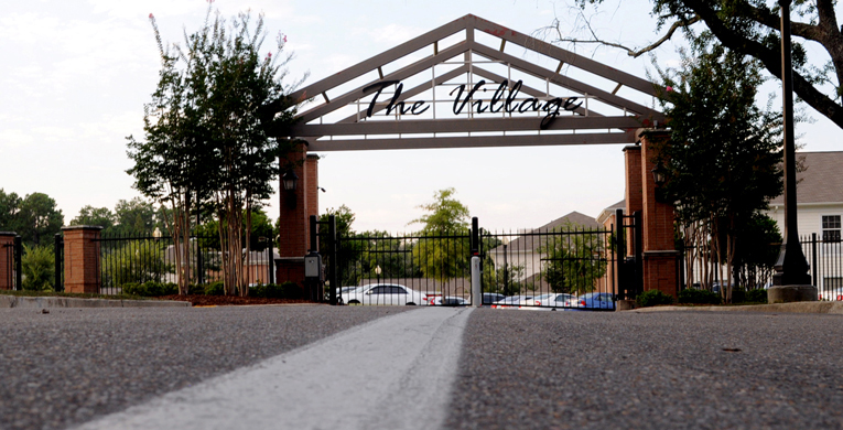 The Village gates that encloses the seven sorority houses remains closed until hundreds of girls run to their new homes on Girls Bid Day, September 9th. |Photo by Susan Broadbridge