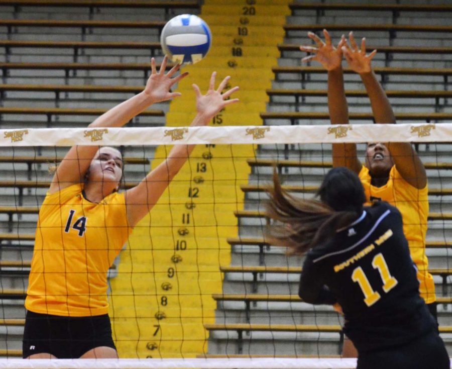 USM junior Elise Ames blocks a shot by her teammate during the Eagles volleyball scrimmage on August 23rd. The Lady Eagles won against LA Tech this past weekend, 3-0.  -Michael Kavitz/Archive