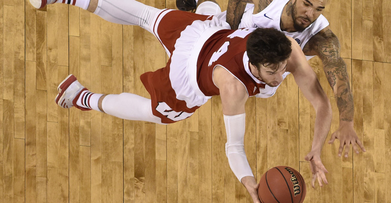 Apr 4, 2015; Indianapolis, IN, USA; Wisconsin Badgers forward Frank Kaminsky (44) shoots the ball against Kentucky Wildcats forward Willie Cauley-Stein (15) during the second half of the 2015 NCAA Mens Division I Championship semi-final game at Lucas Oil Stadium. Mandatory Credit: Bob Donnan-USA TODAY Sports
