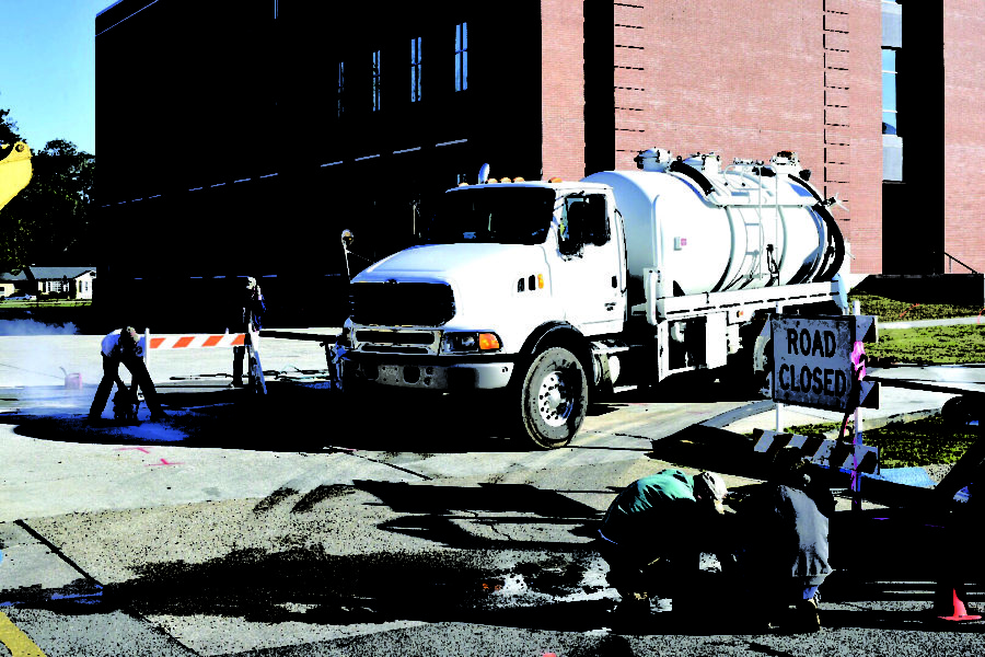 Workers fixing a sinkhole that appeared in the parking lot between McCarty Hall and Scianna Hall on Janurary 12.