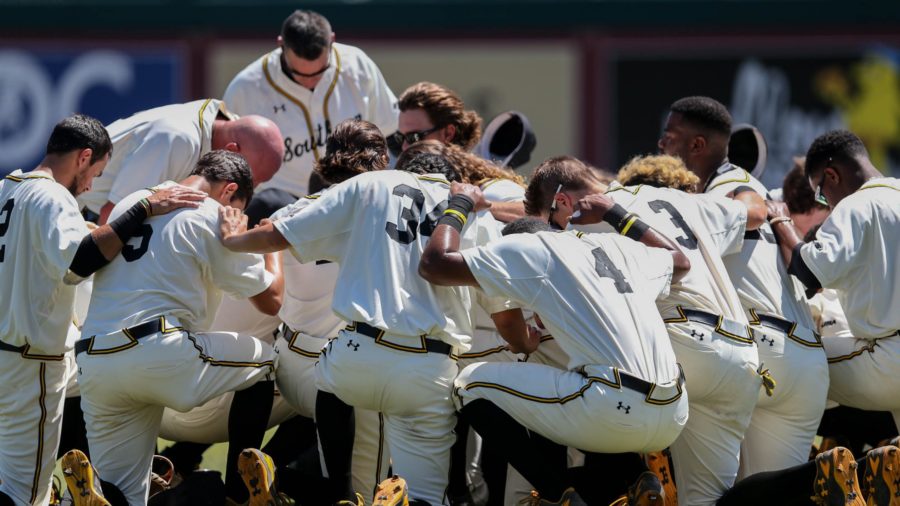 The Southern Miss Golden Eagles huddle together before they play South Alabama at the NCAA 2016 Division I baseball championship in Tallahassee, Florida on June 3, 2016.