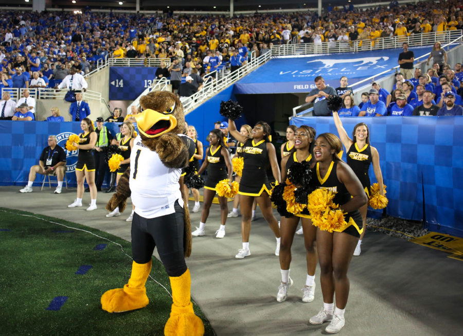Seymour poses with Southern Miss cheerleaders at the Southern Miss vs. Kentucky football game on Sunday, Sep 4th, 2016. ( Student Printz/Fadi Shahin)