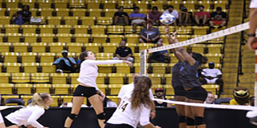 Junior Stephany Purdue tips the ball over the net at the Southern Miss invitational on August 29, 2015.