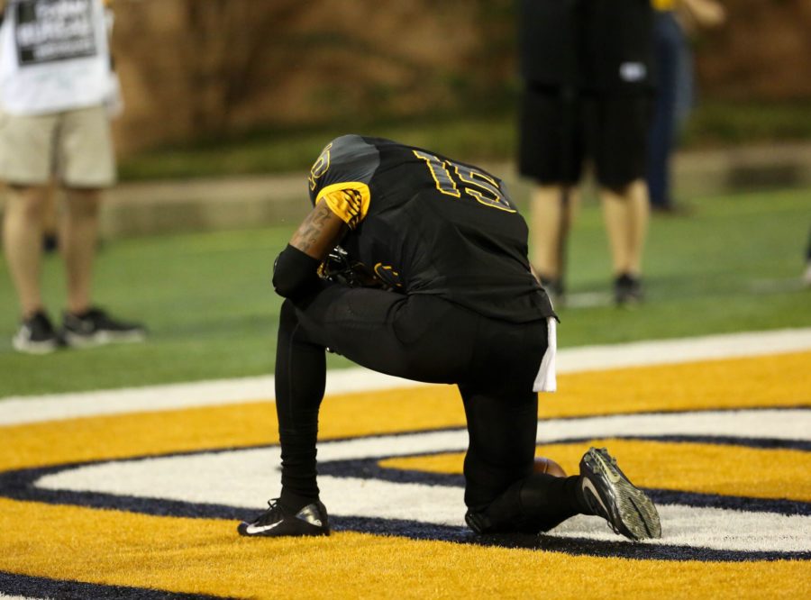 Allenzae Staggers kneels after scoring a touchdown during Southern Miss 44-28 victory over Rice on Oct. 1.