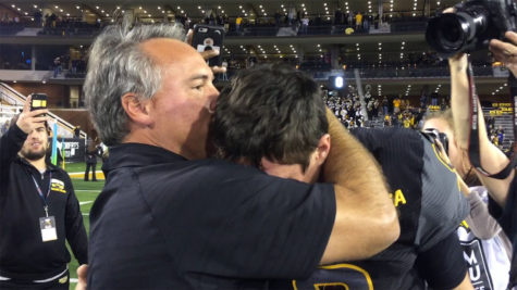 Southern Miss Head Coach Jay Hopson and quarterback Nick Mullens embrace each other after their 39-24 win over Louisiana Tech on Nov. 25 at M.M. Roberts Stadium.