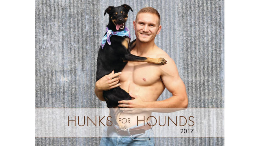 Hunks pose with pups for humane society