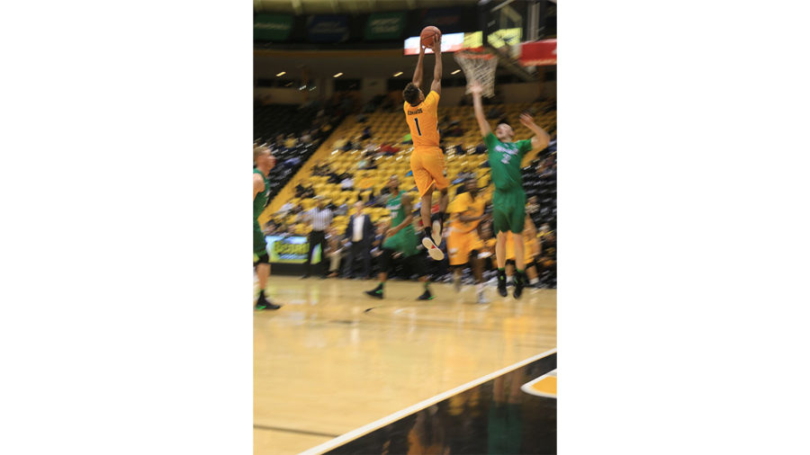 Cortez Edwards leaps up for a dunk against Marshall on Feb. 2.