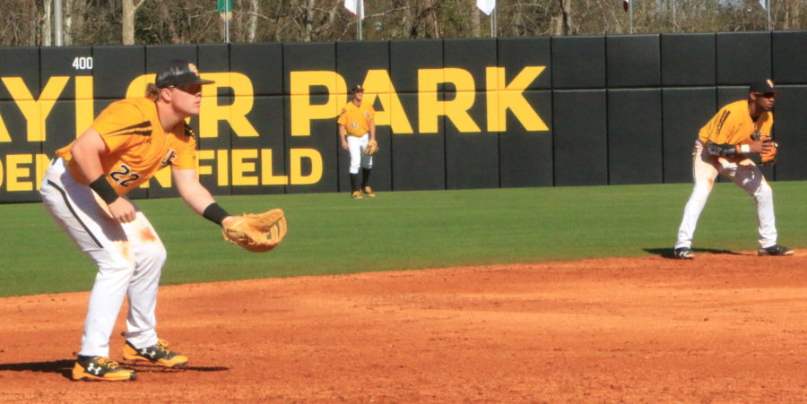 The Southern Miss defense prepares for a play at Pete Taylor Park against the Northeastern Huskies on Feb. 19.