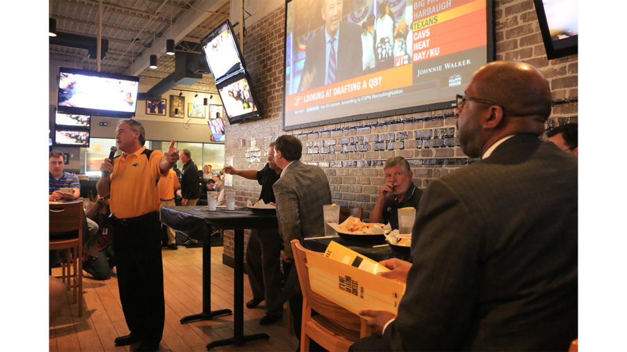 Coach Jay Hopson commends USM president Rodney Bennett for his work during a Signing Day special on Feb. 1 at Buffalo Wild Wings. 