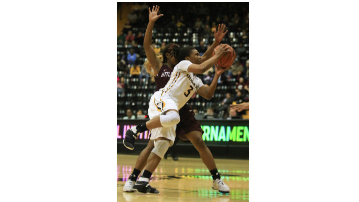 Keri Jewett-Giles forces her way through the Little Rock defense to make a play in the WNIT at Reed Green Coliseum on Mar. 15.
