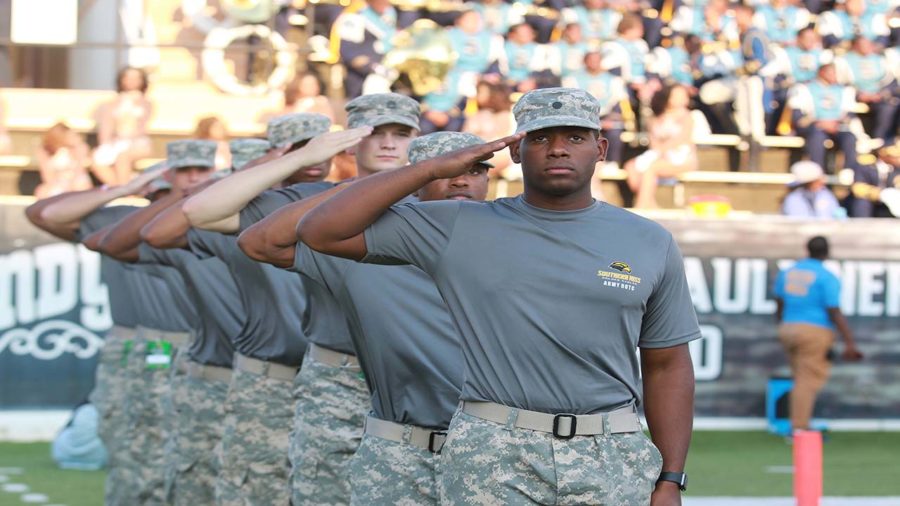 Eagle+Battalion+stand+and+salutes+during+the+national+anthem.%0APhoto%3A+Kenyatta+S.+Ross%2C+Photo+Editor