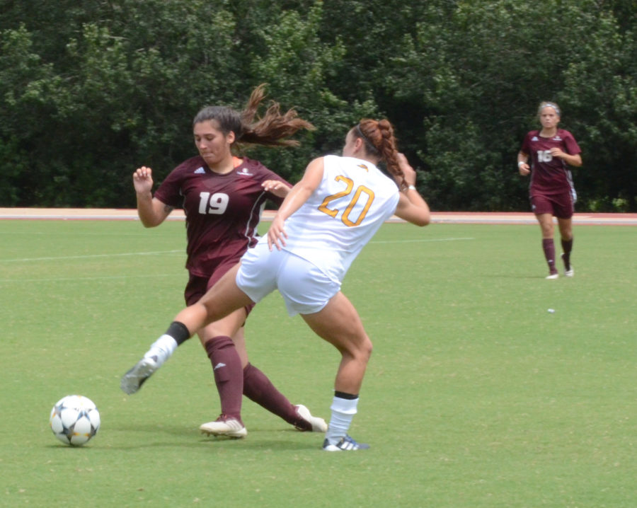 Morgan Robertson challenged for the ball as she heads to the goal.