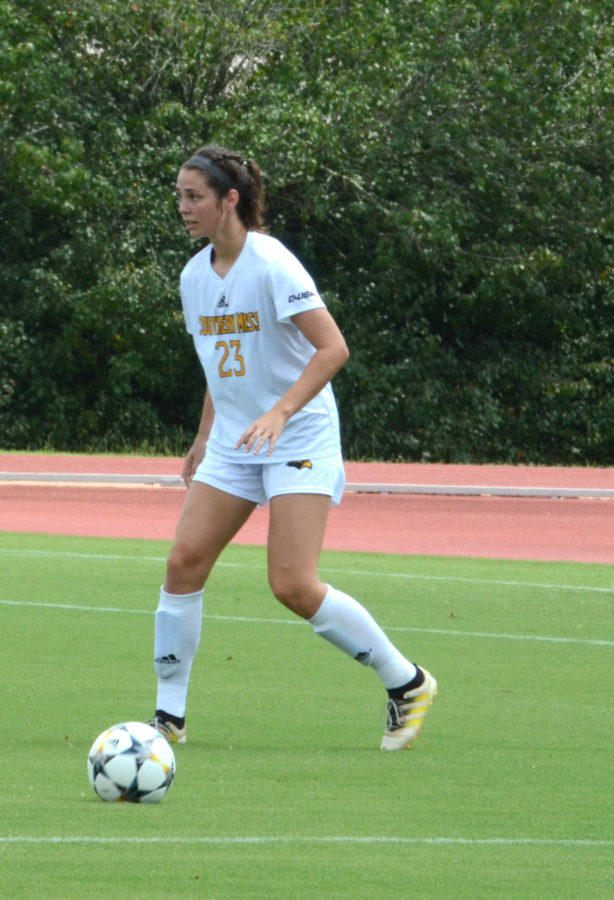 Jennyfer Caracheo dibbles down the field.