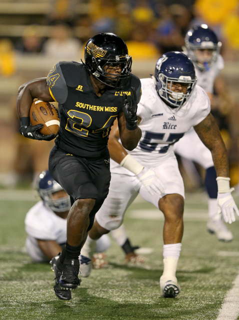 Oct 1, 2016; Hattiesburg, MS, USA; Southern Miss Golden Eagles running back George Payne (24) runs from Rice Owls defensive tackle Preston Gordon (57) in the second half at M.M. Roberts Stadium. Southern Miss won, 44-28. Mandatory Credit: Chuck Cook-USA TODAY Sports