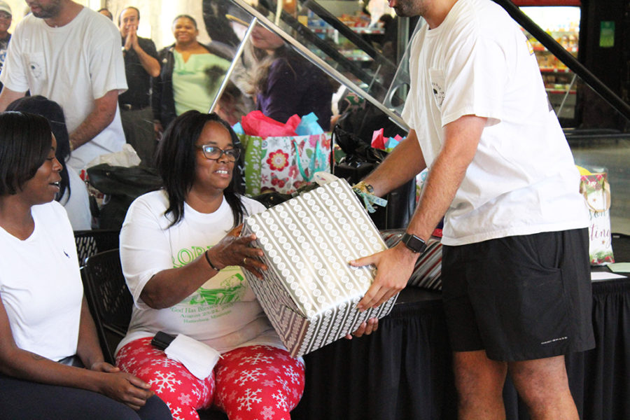 Reslife staff member Minnie Williams accepts a gift. (Brian Winters)