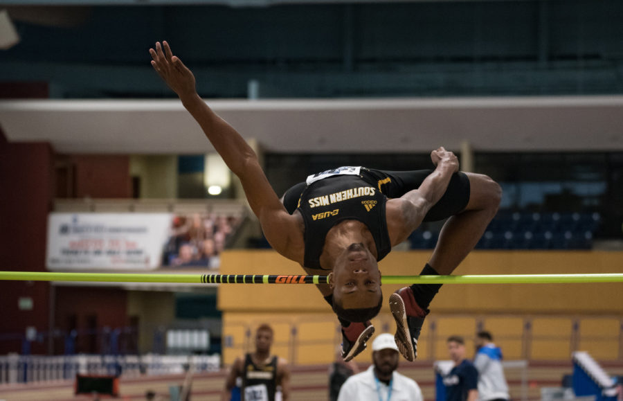 Eric Richards jumps for first place in the Mens High Jump