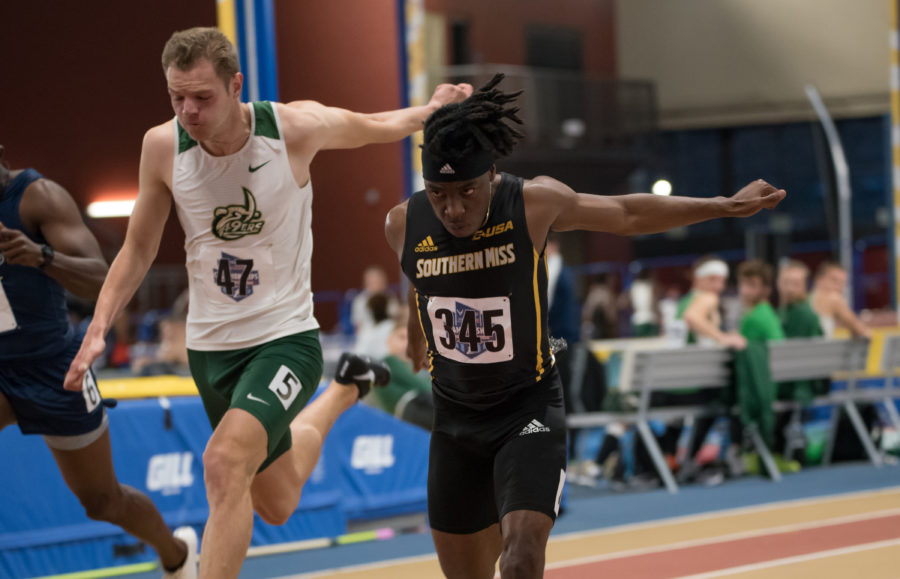 Chedlin Sagesse leans to win his heat of the Mens 60 meter Dash