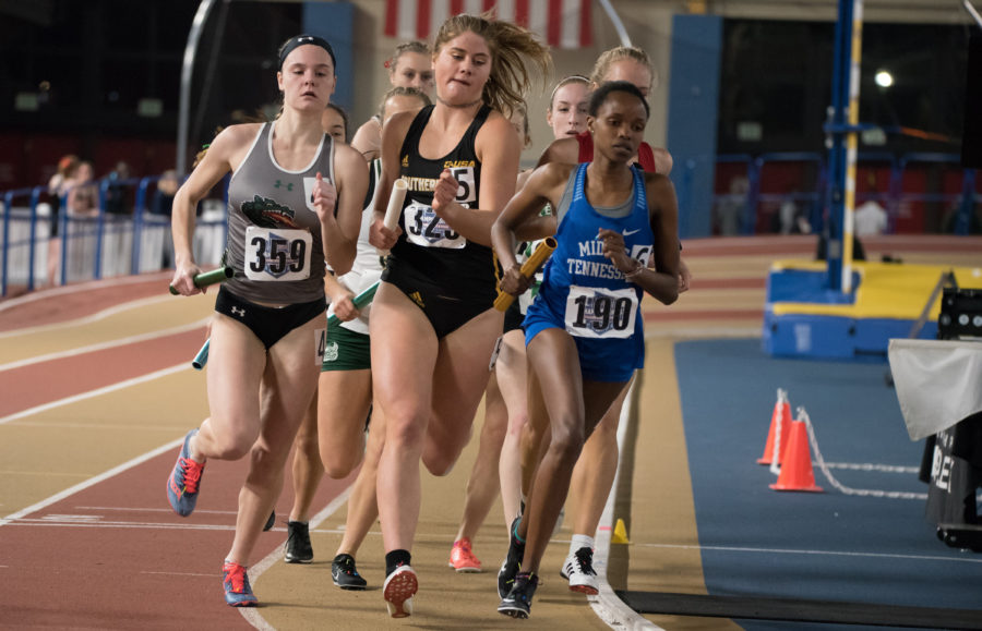 Kate Maddox fighting for position in the Womens Distance Medley Relay