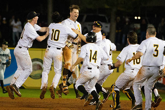 Guidry and team celebrates after walk-off win. Photo by: Brad Crowe 