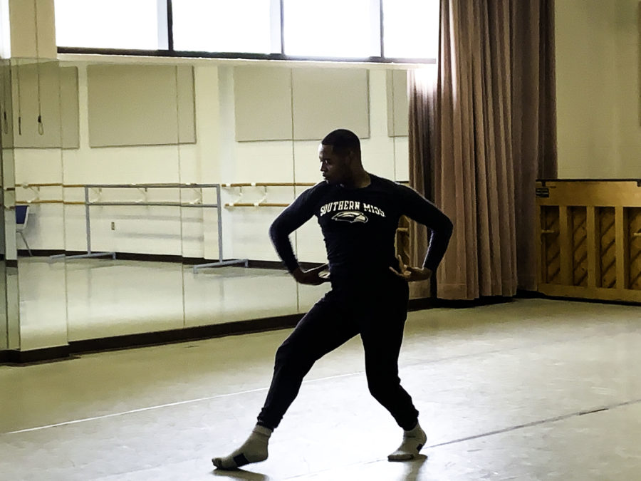 Delarence Collins dances in the ballet studio. Photo by Lillie Busch. 