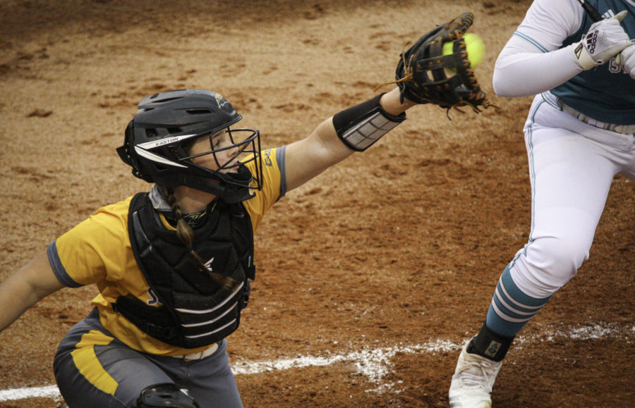 Southern Miss catcher Hannah Borden catches a pitch from Karsen Pierce.