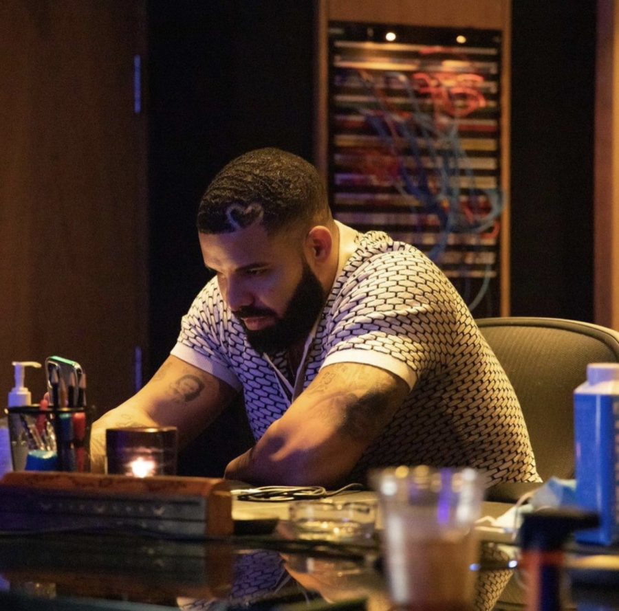 Drake looking sad at the bar