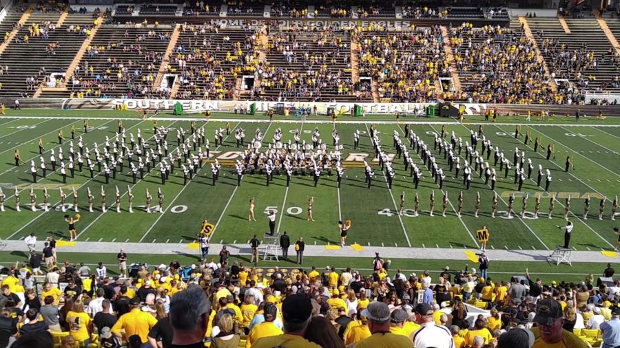 The Pride of Southern Mississippi Marching Band on the football field. 