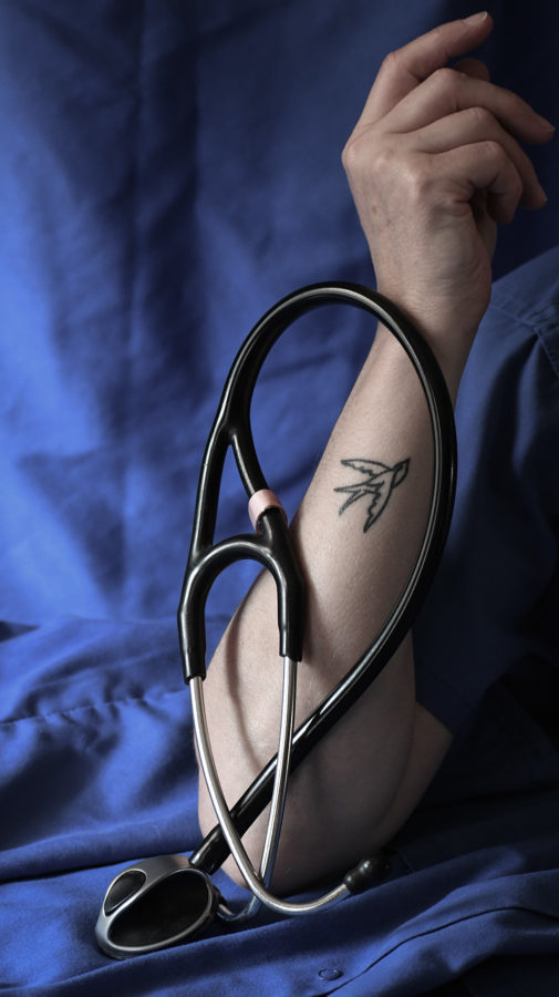 nurse with sparrow tattoo