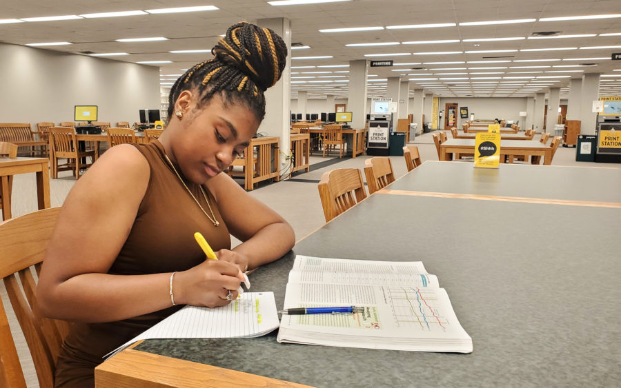 Rhyan Jones studies in the Cook Library. (Photo/Garret Grove)