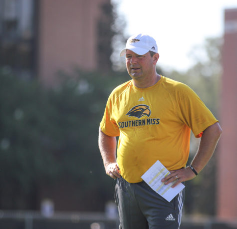 Head Coach Will Hall watches the Golden Eagles practice