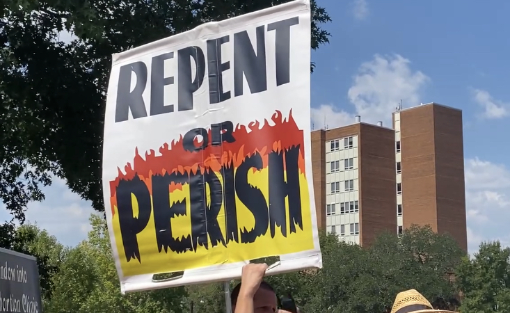 A sign from the protestors that reads Repent or Perish. | Abigail Troth, SM2