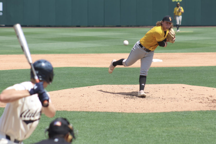 #21 Bily Oldham delivers a pitch against Auburn in the Auburn Regional