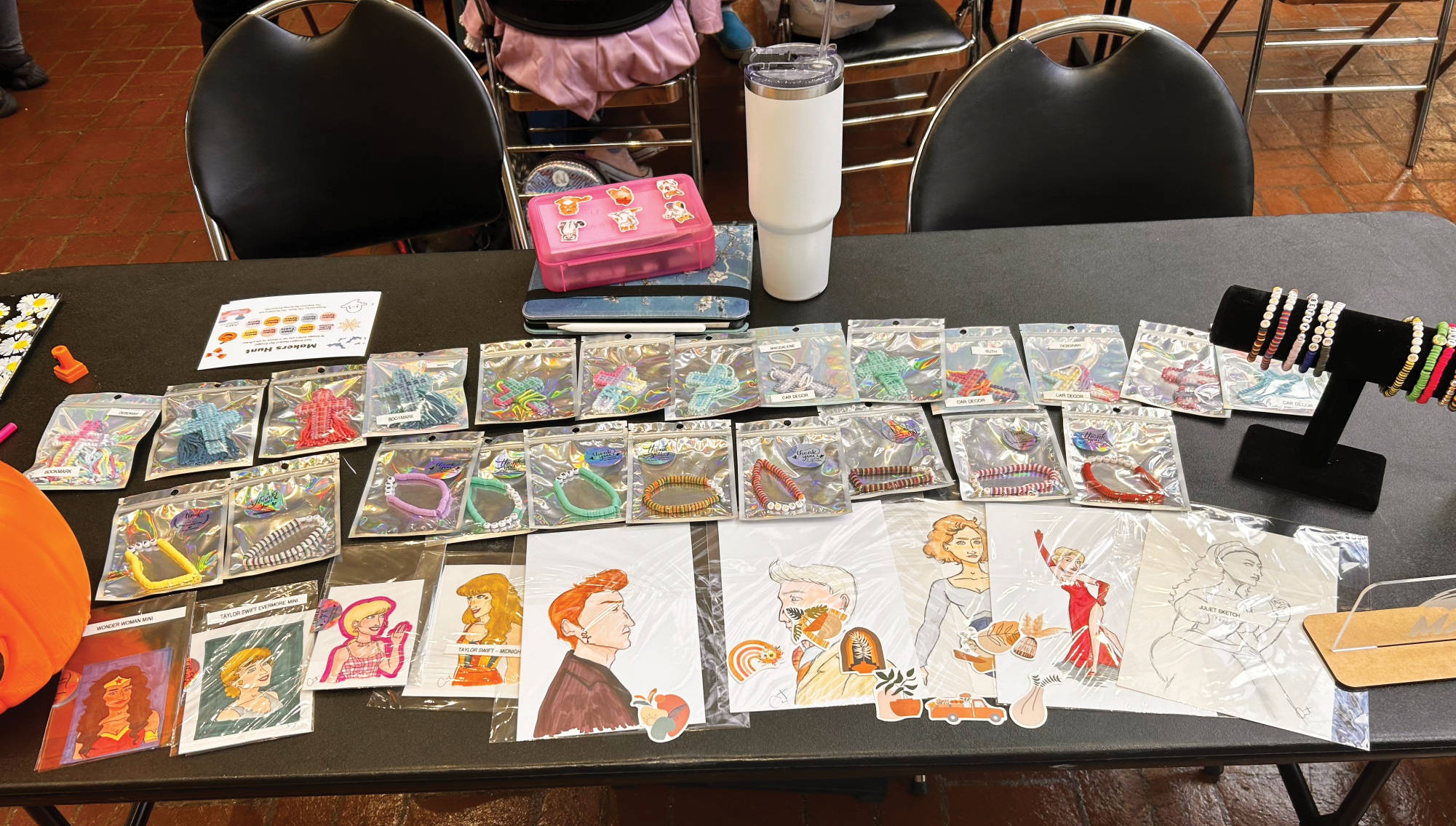 The Halloween Makers’ Market was held on Oct. 27, with many student creators showing up to sell their wares. One maker’s table featured bracelets, drawings and bookmarks.    						                                      
