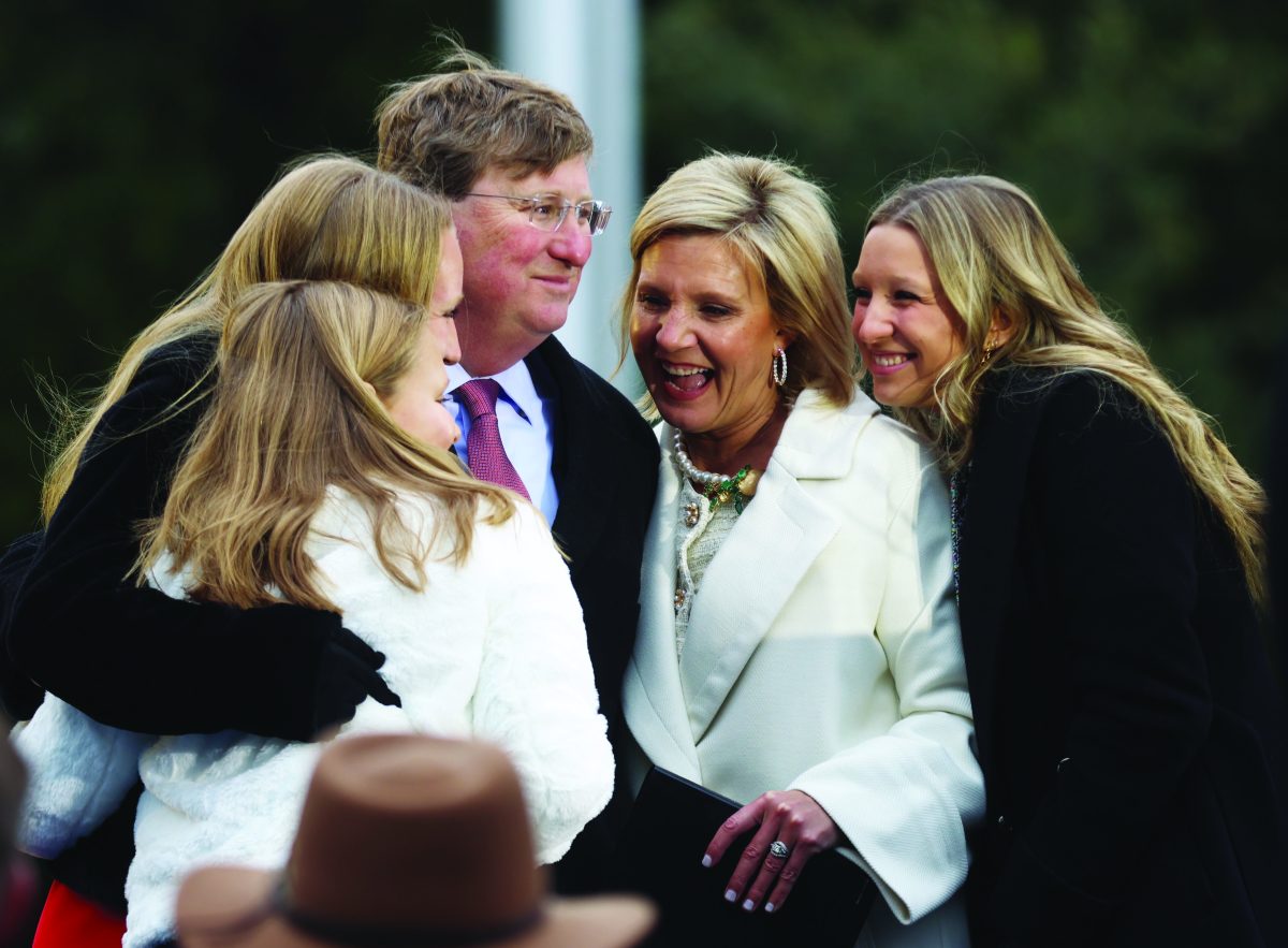 Gov.+Tate+Reeves+hugs+First+Lady+Elee+Reeves+and+their+three+daughters+at+his+second+inauguration%2C+where+Reeves+made+promises+to+make+Mississippi+better+for+everyone.