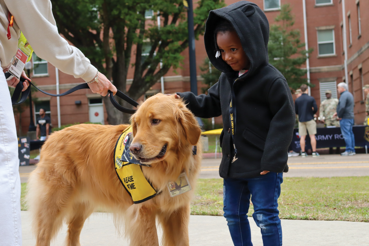 Cash Money, USM’s resident therapy dog, made his grand entrance at Going Gold Day, greeting the community and providing smiles.  