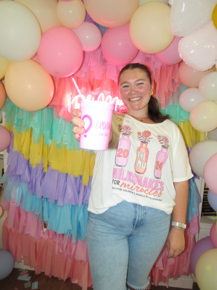 Director of the event, Cloé Knight, holds a milkshake made by members of the chapter.