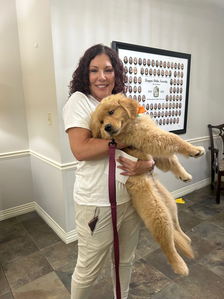 Melinda Lowery and the newest campus therapy dog, Sunday.