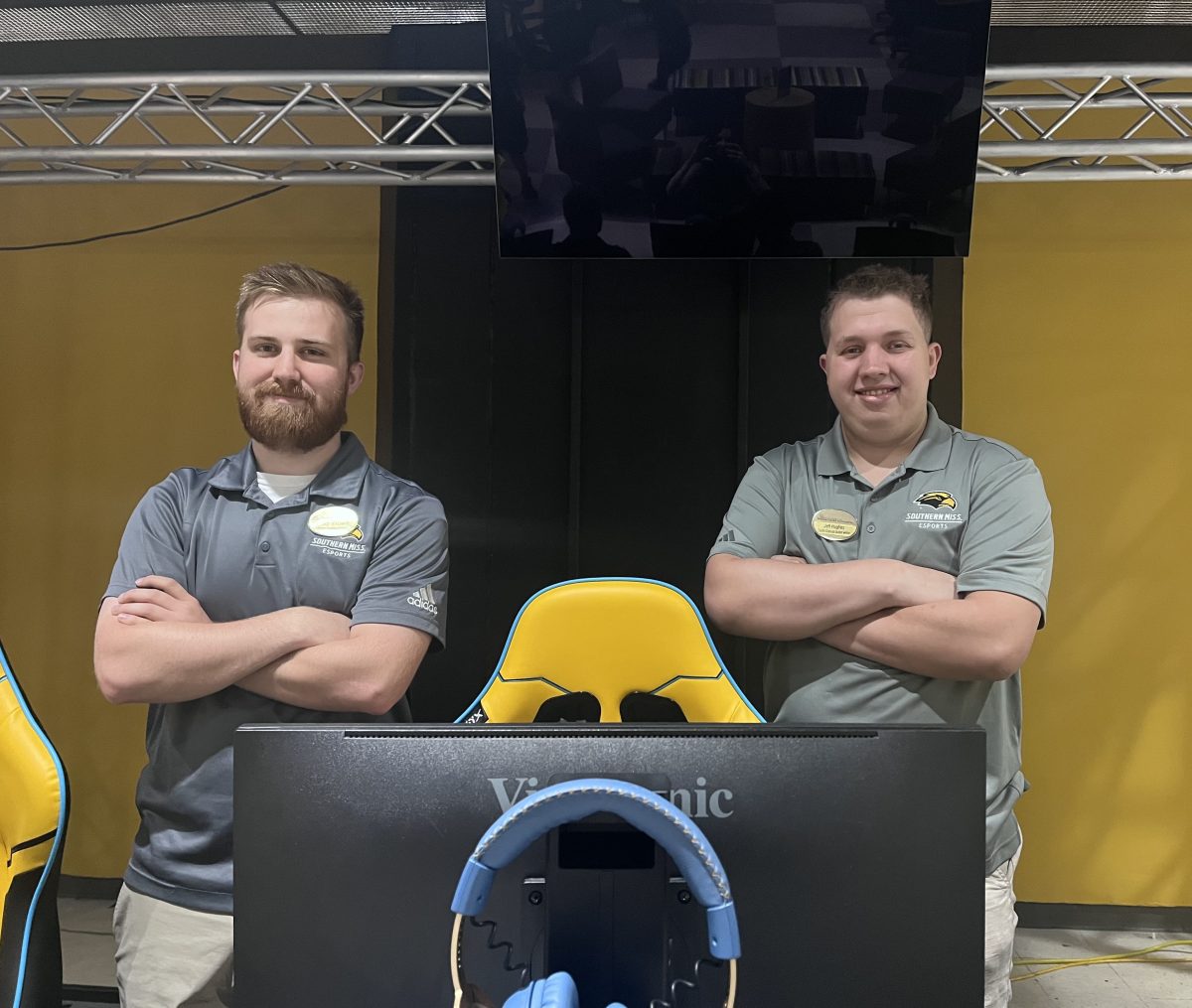 USM ESports coaches, Jeff Hughes and Joseph Blackwell standing in the ESports arena.