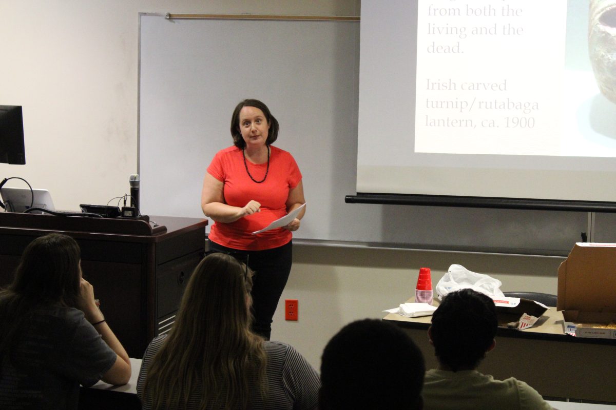 Dr. Courtney Luckhardt, a professor of medieval history at Southern Miss, gives a Halloween lecture to the USM History Club.