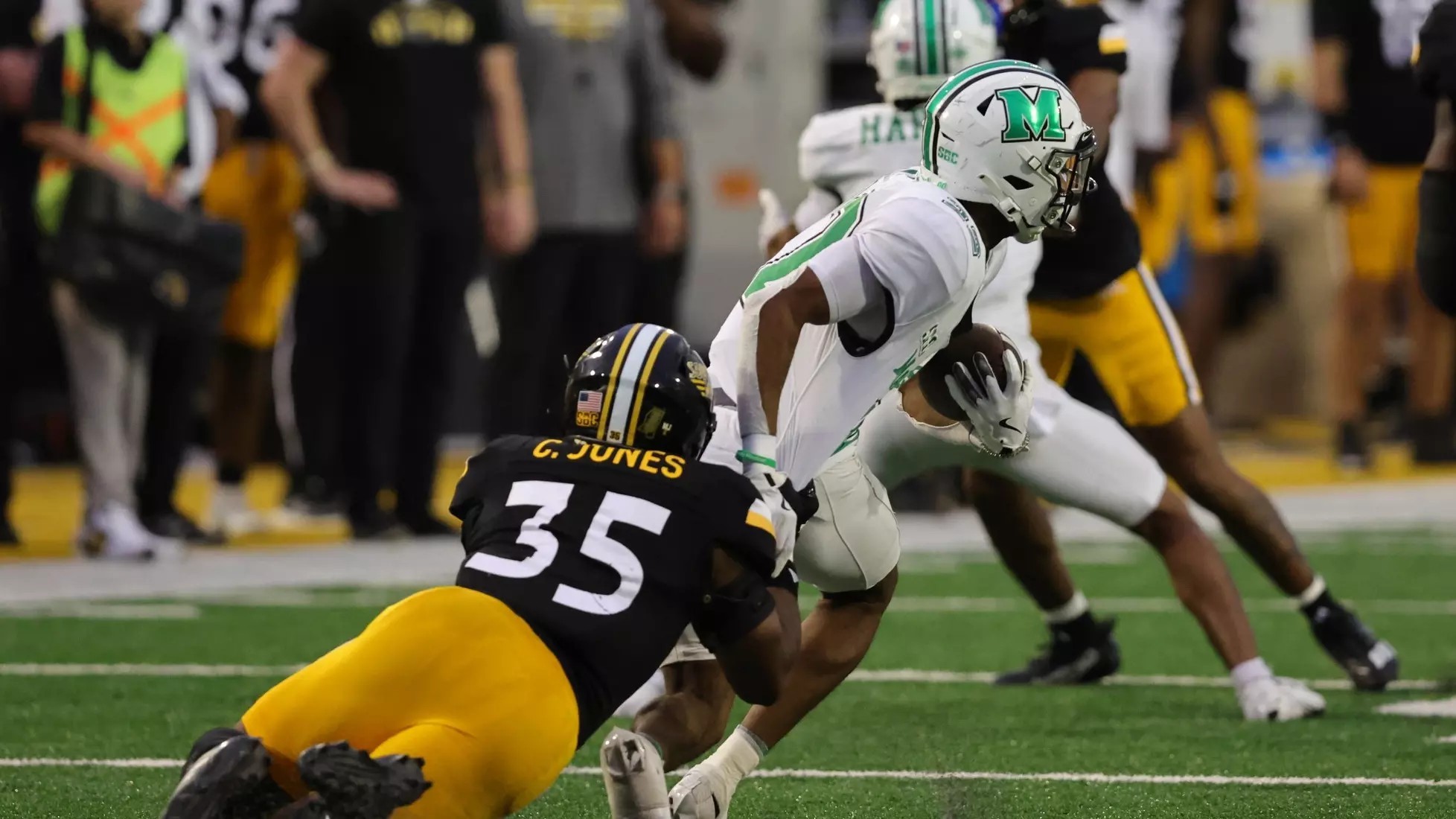 USM's Chris Jones drags down a Marshall wide receiver.