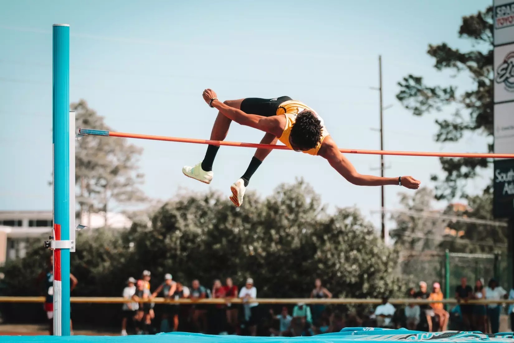 Zayne Palomino completes a high jump at a recent track and field competition.