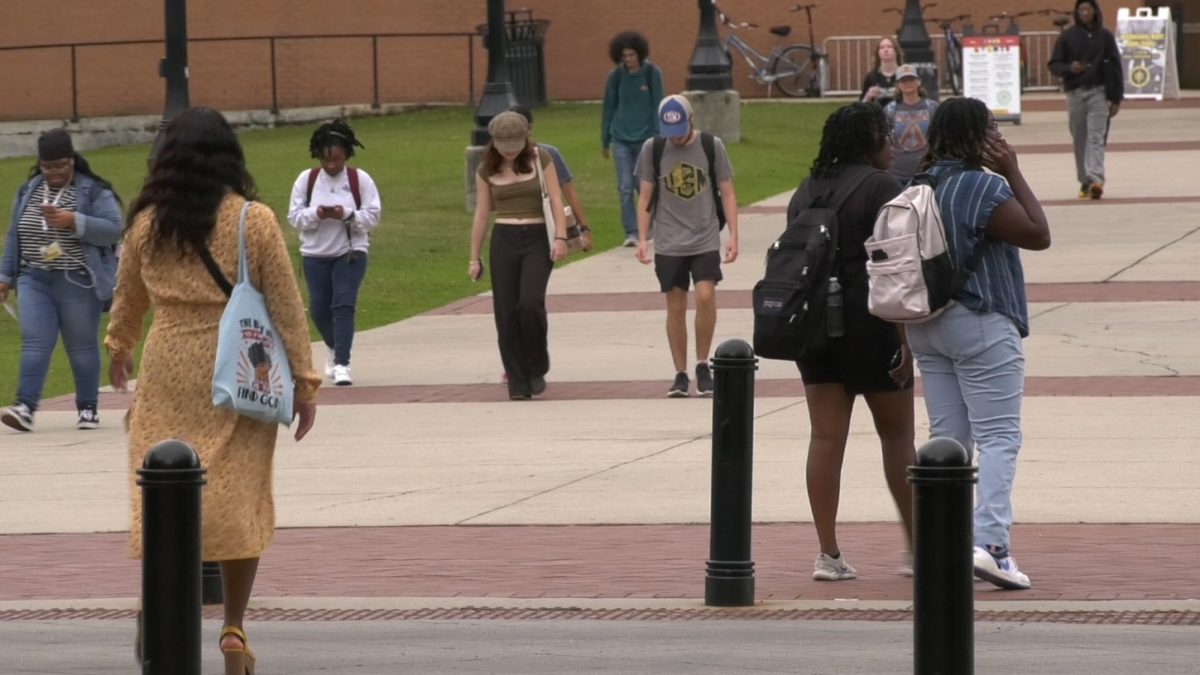 Southern Miss students walk near the residence halls on campus.