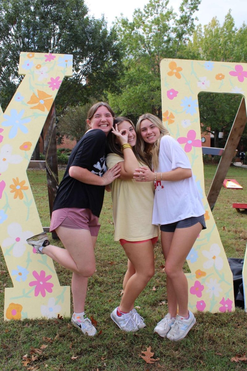 Members of Chi Omega at the "Pie A Chi" event.