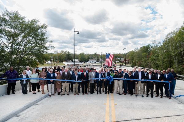 State and local officials gather for the Hall Avenue East Overpass ribbon cutting. 