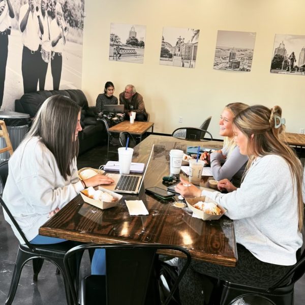 College students gather inside Mo’Bay Beignet, located across from Southern Miss.